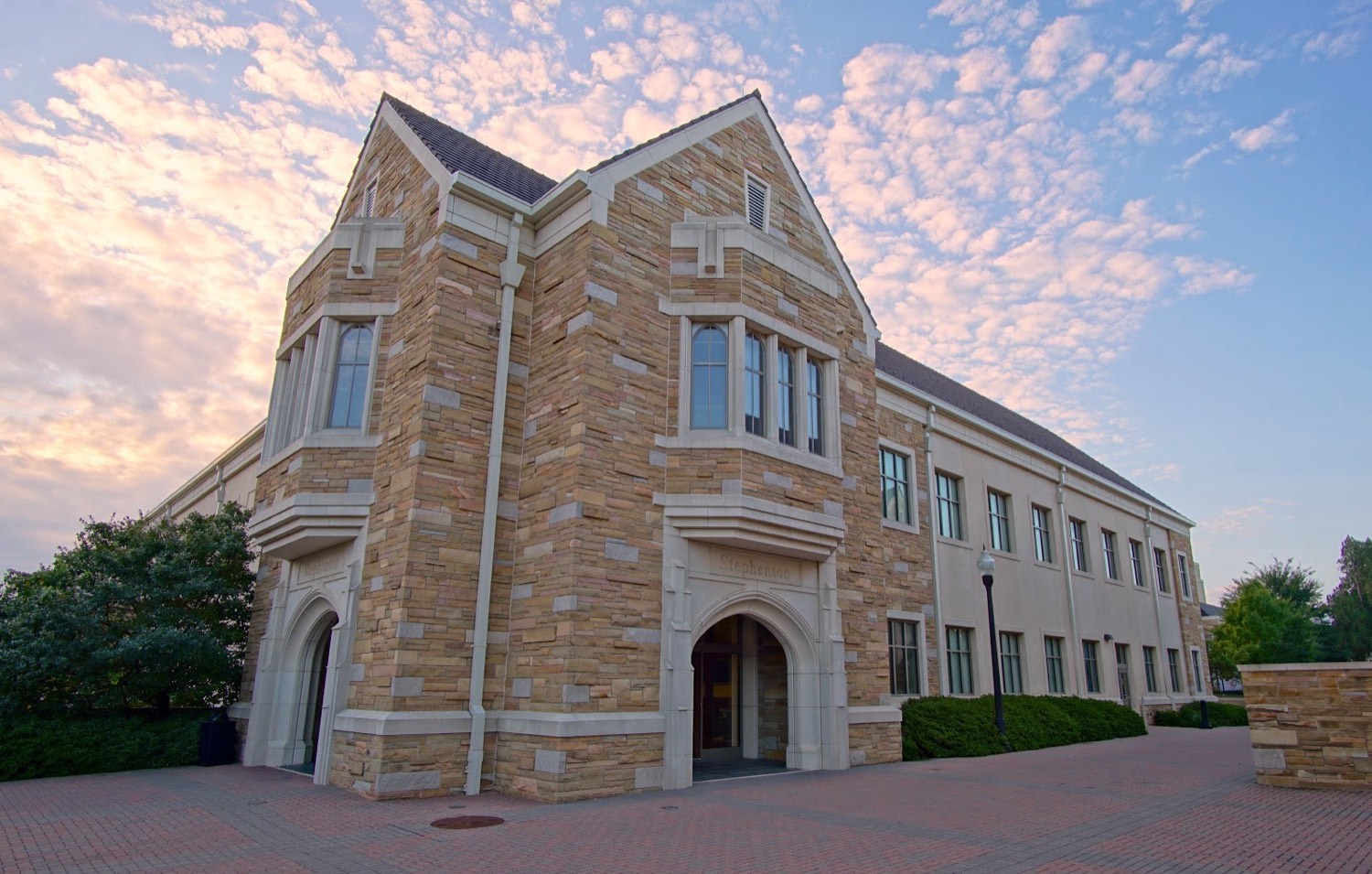 Stephenson Hall at The University of Tulsa, the stone building that houses the AMDG lab, photographed at sunset.